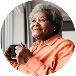 Man in blue shirt, wearing glasses, and talking on a cell phone